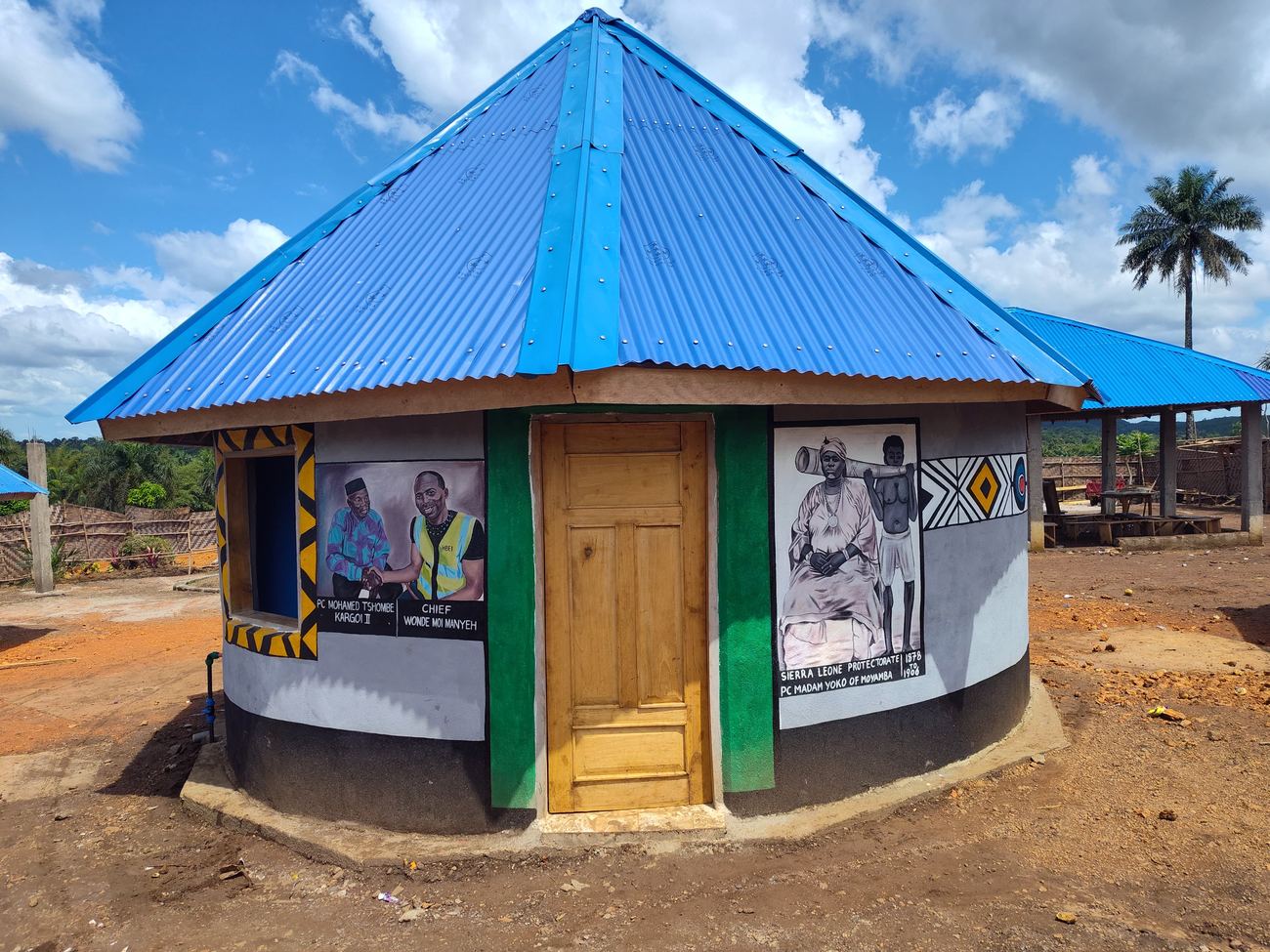 Hand-painted round eco-lodge with blue roof